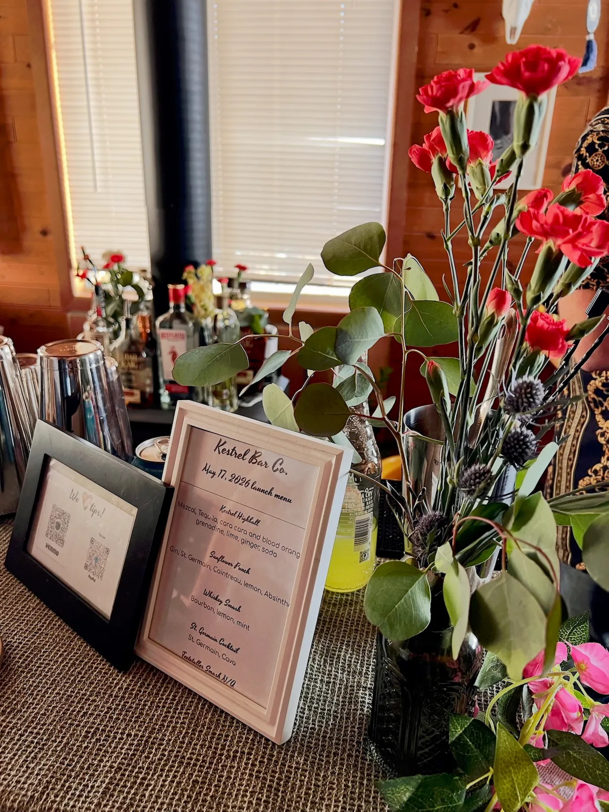 Our cocktail menu display on a bar top from one of our recent events